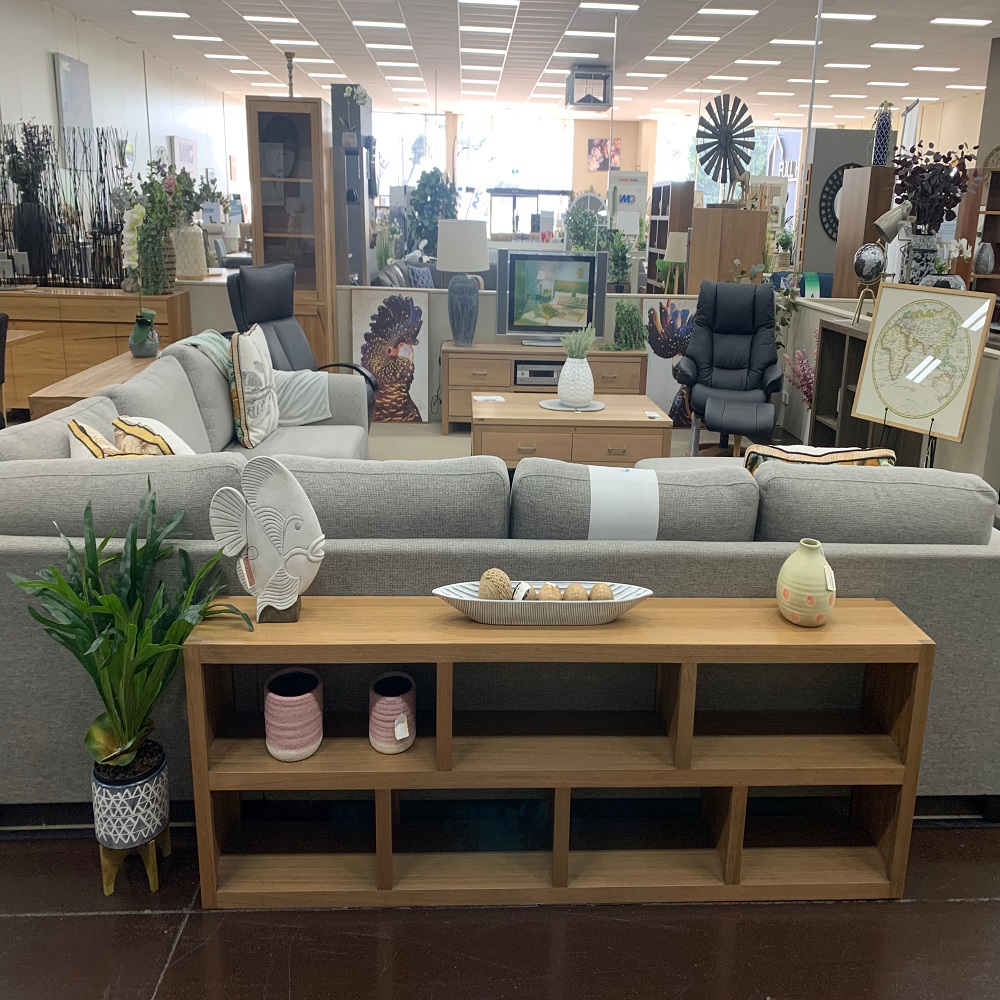 low bookcase behind sofa